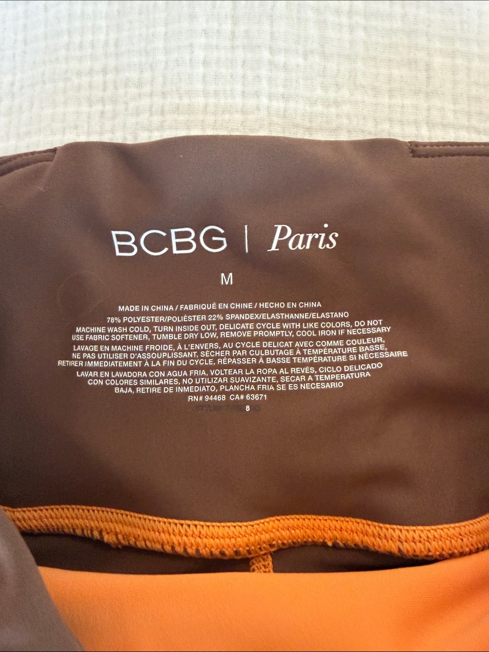 BCBG Orange and Brown Athletic Leggings with White Stripes - Picture 2 of 3